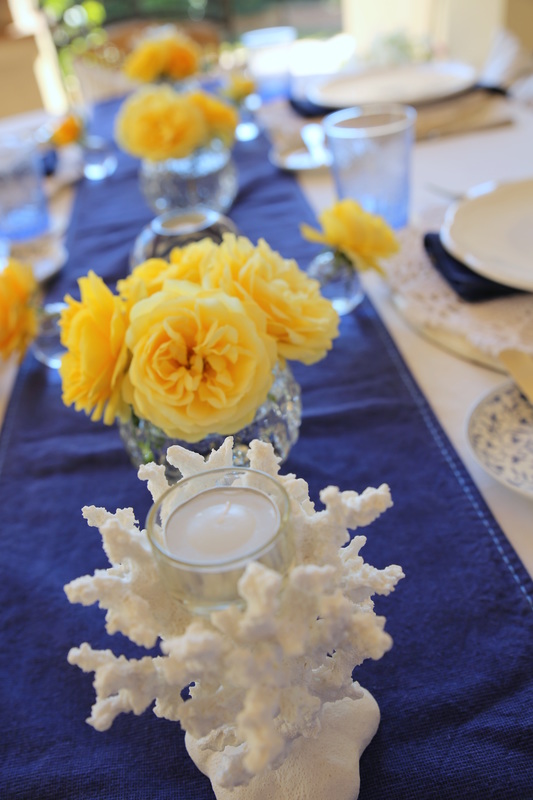 Blue, white and yellow tablescape by The Belle Blog
